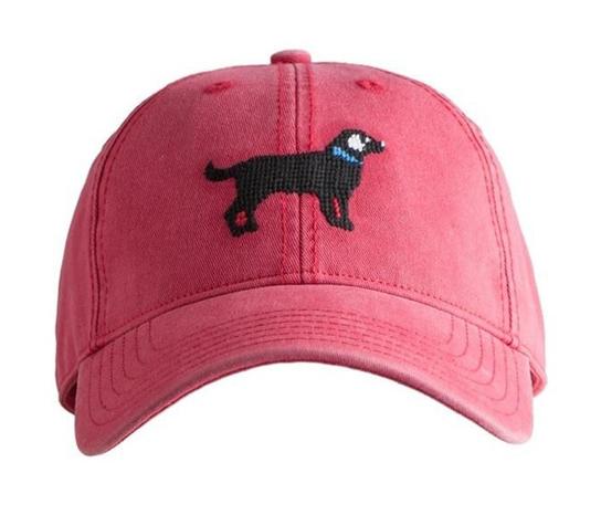 Black Lab on Weathered Red Hat