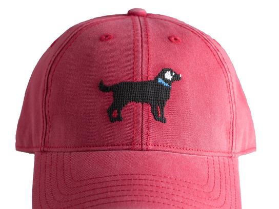 Black Lab on Weathered Red Hat